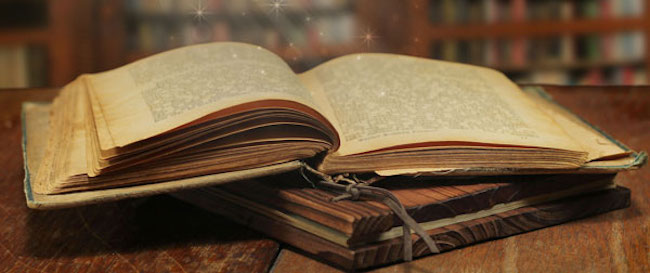 Opened magic book with magic light